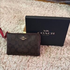 Coach Brown Signature Wristlet with Red Trim and Gold Hardware